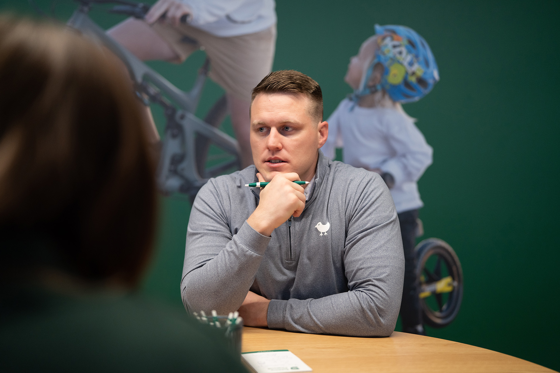 Blake Robbins, founder, CEO and award winning financial planner at Robbins Financial, Financial Advisors serving NW Arkansas sits amid a bustling crowd